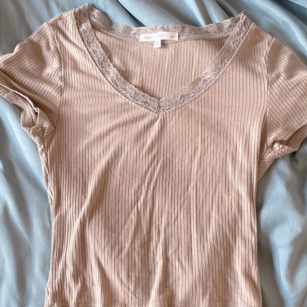 Cute lace beige top thin material but feels nice